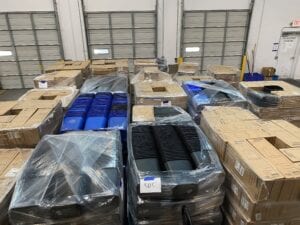 palettes loaded with wastebaskets